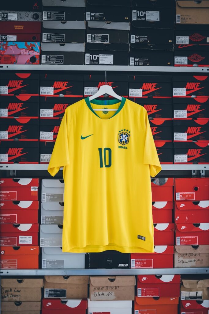 hanging yellow and green Nike soccer jersey shirt