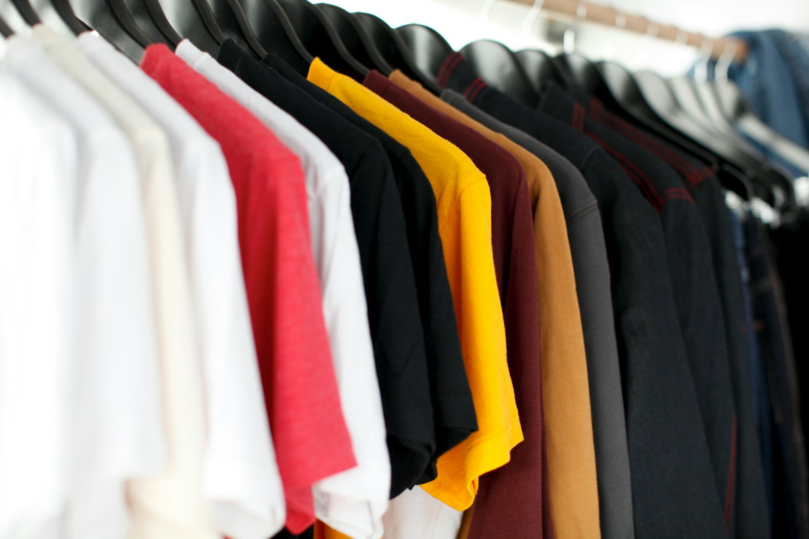 closeup of hanged shirts on rack rayon vs cotton