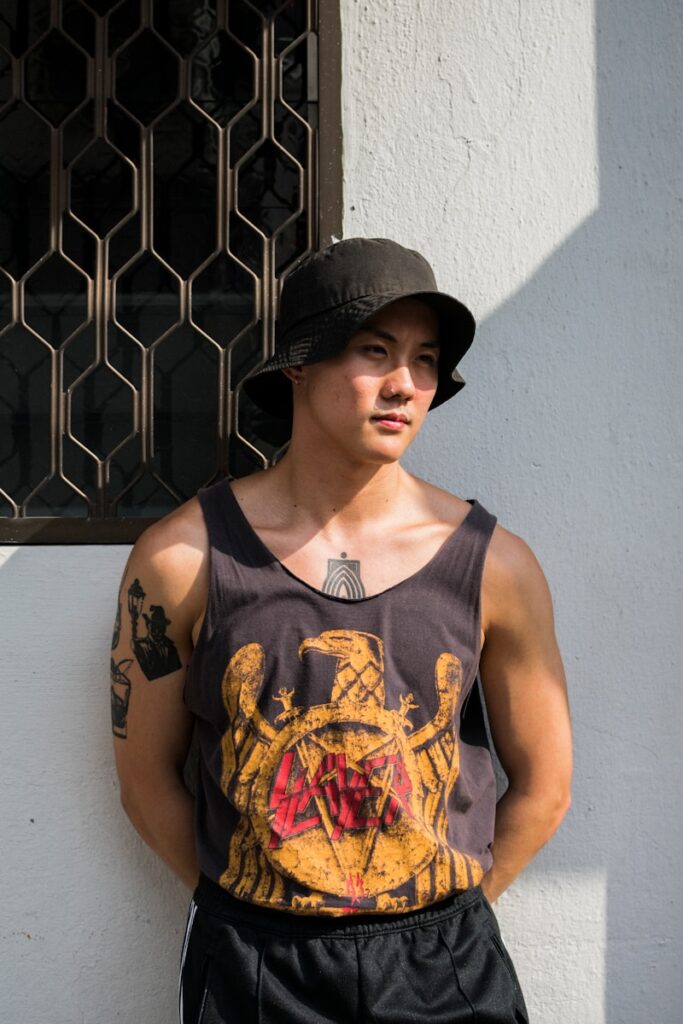 man leaning on wall