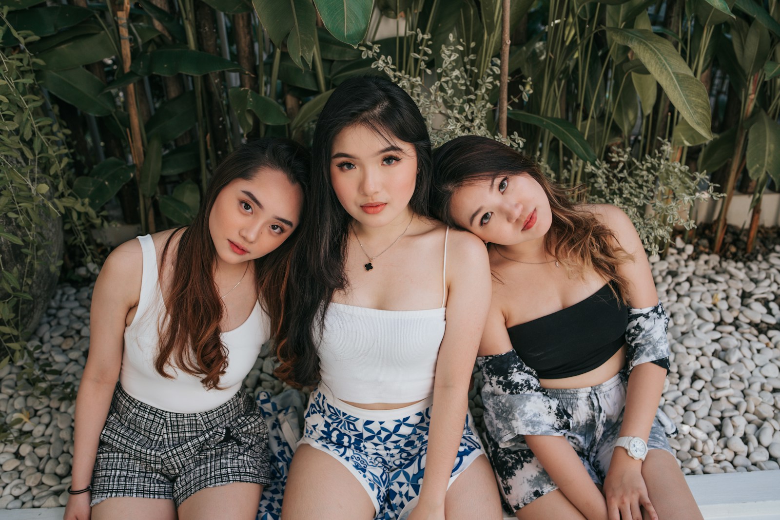 3 women in white and black floral tube dress types of tank tops