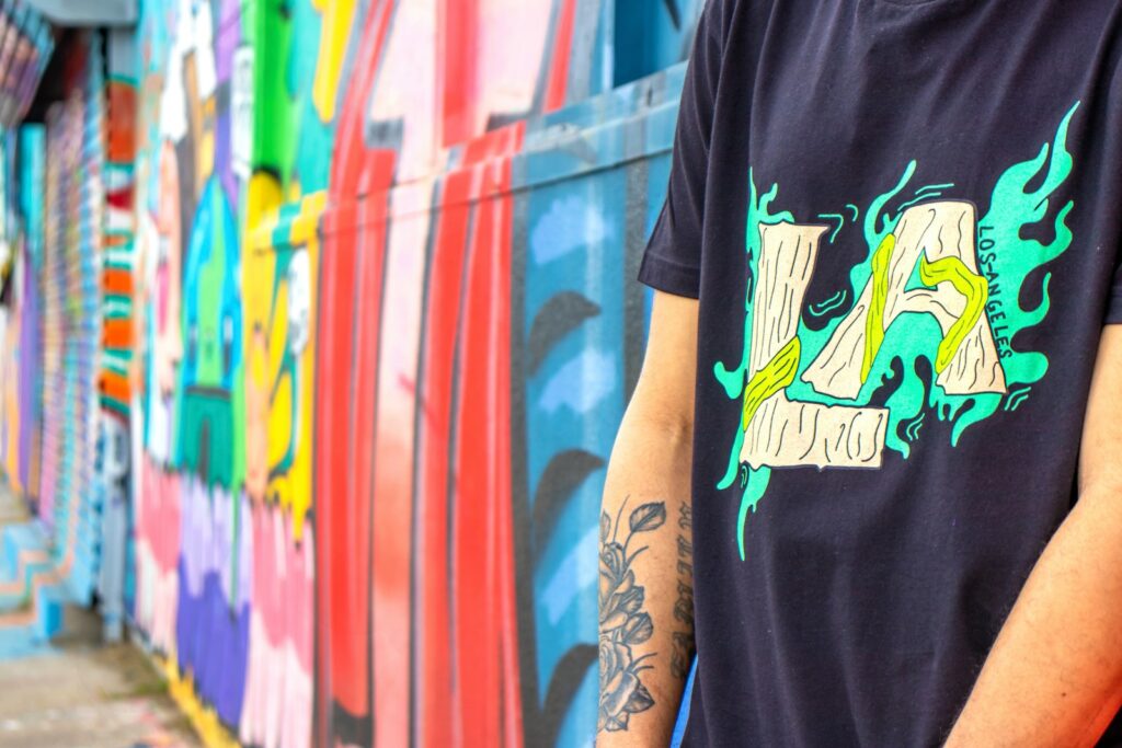 man in black crew neck t-shirt with tattoo on right arm