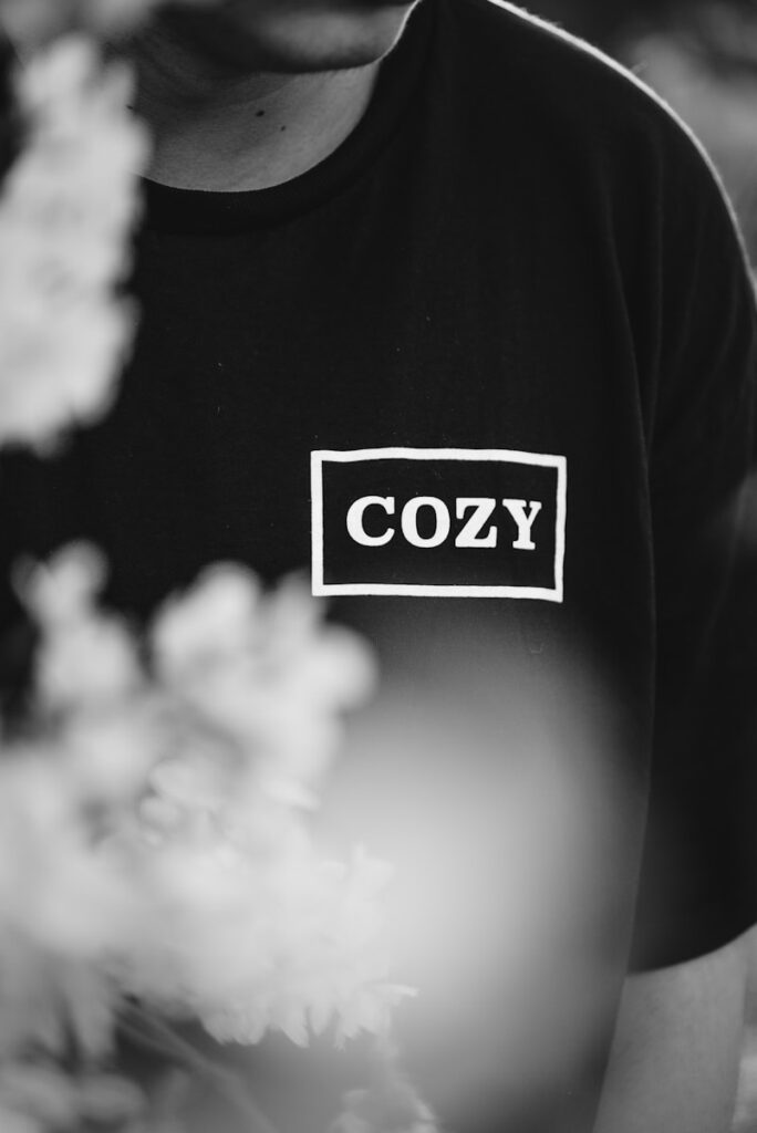 grayscale photography of man in shirt