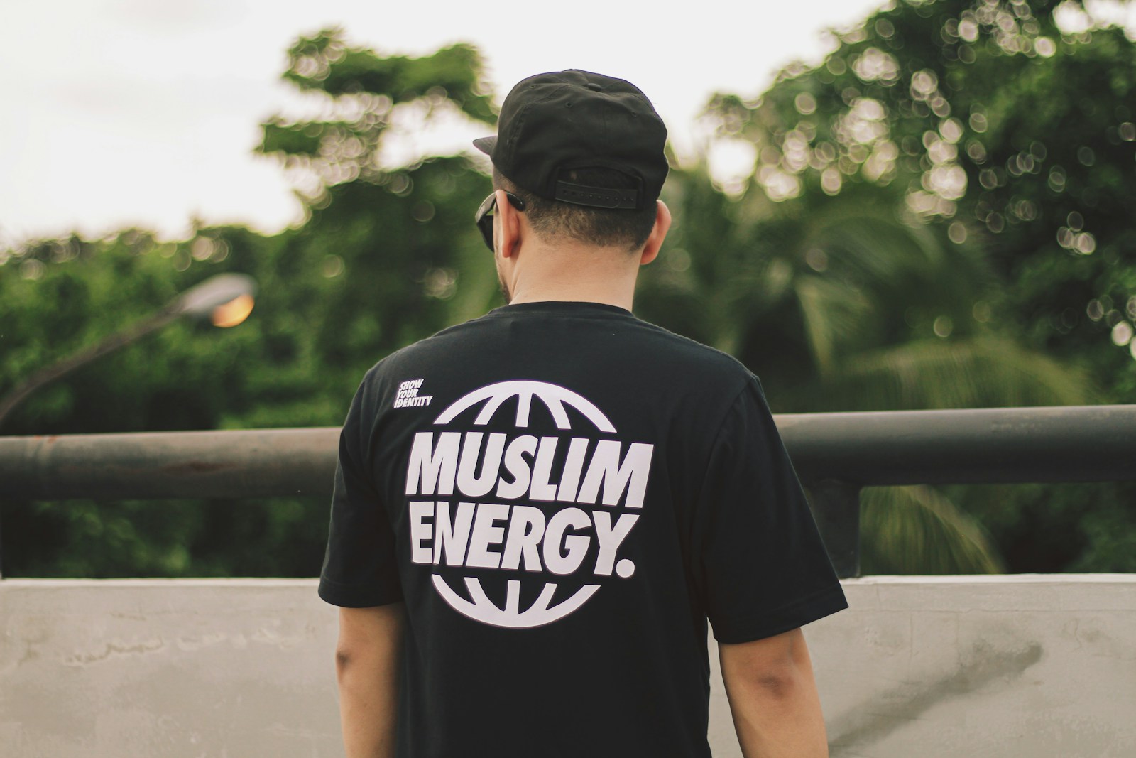 a man wearing a t - shirt that says muslim energy FAQs about (DTF Transfers) | Everything You Need to Know