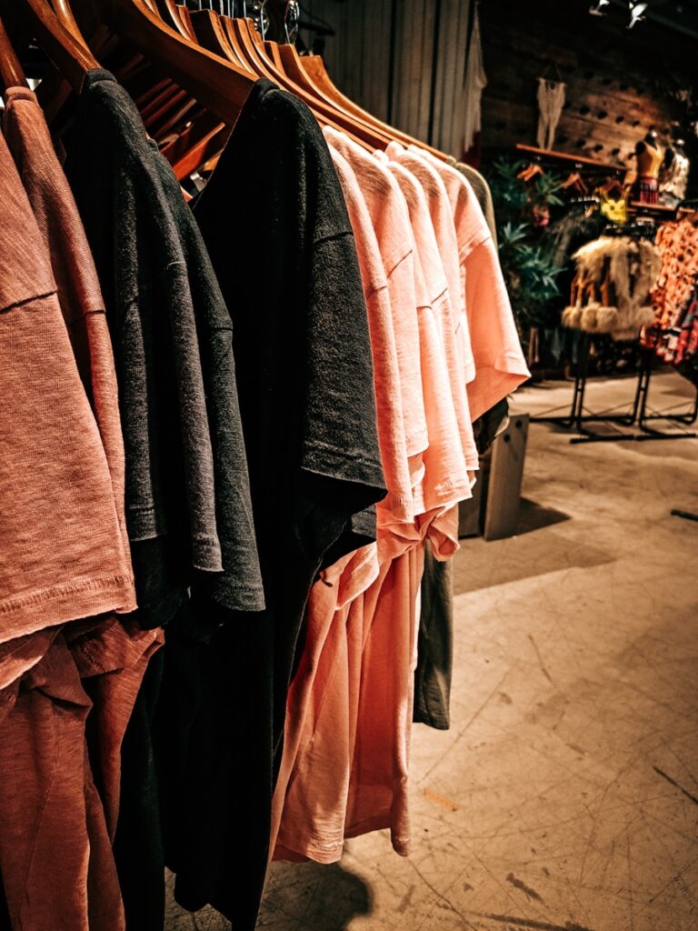 a row of clothes hanging on a rack