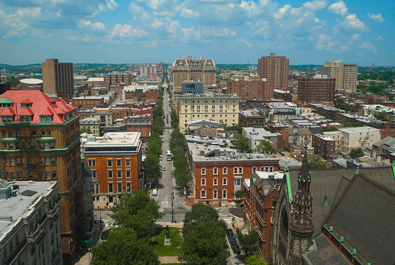 Aerial view of Baltimore city, showcasing its distinctive architecture and urban layout on a bright day.