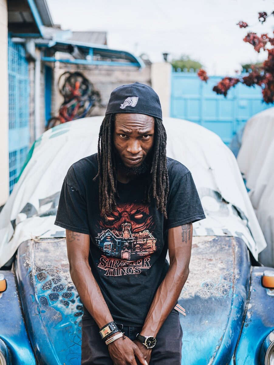 Photo by Michael Kyule Man with dreadlocks wearing a stranger things t-shirt.
