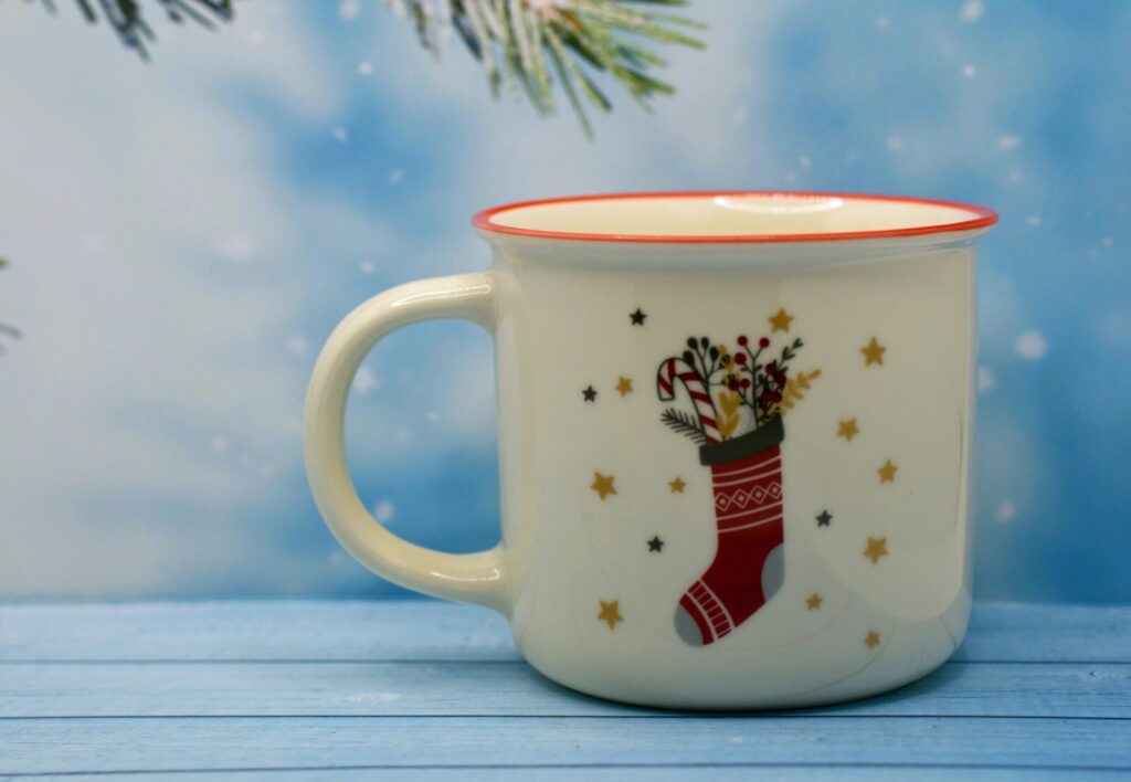 a coffee mug with a christmas stocking on it