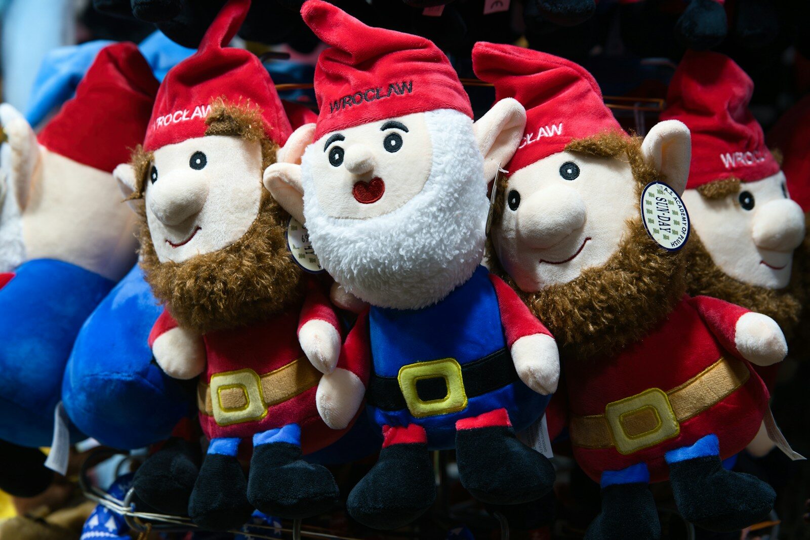 Several plush gnomes with red hats and beards