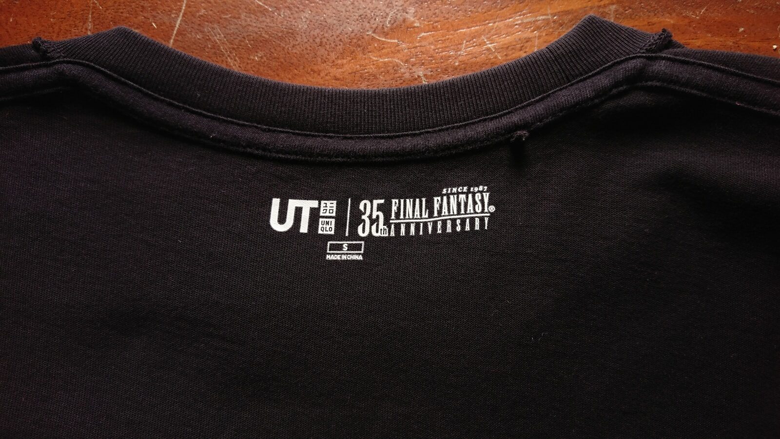 Black t-shirt with ut final fantasy 35th anniversary logo. Direct to Film Transfers Tips: How to Improve Print Quality Every Time