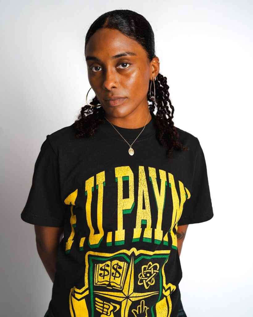 A young black woman wearing a black t-shirt.