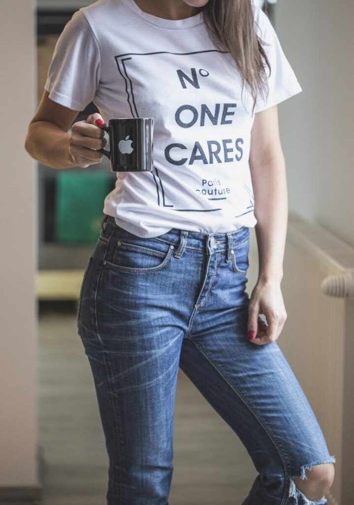 jeans, tee, t shirt, coffee cup, white, blue, woman, model, standing, mug, cup, coffee, tea, hot, drink, tea cup, hair, quote, statement, ripped, top, trousers, home, young, casual, outfit