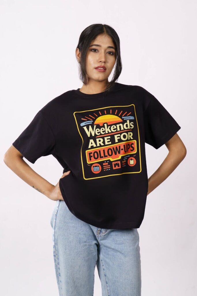 Stylish woman wearing an oversized t-shirt with 'Weekends are for Follow-ups' print, casual look.