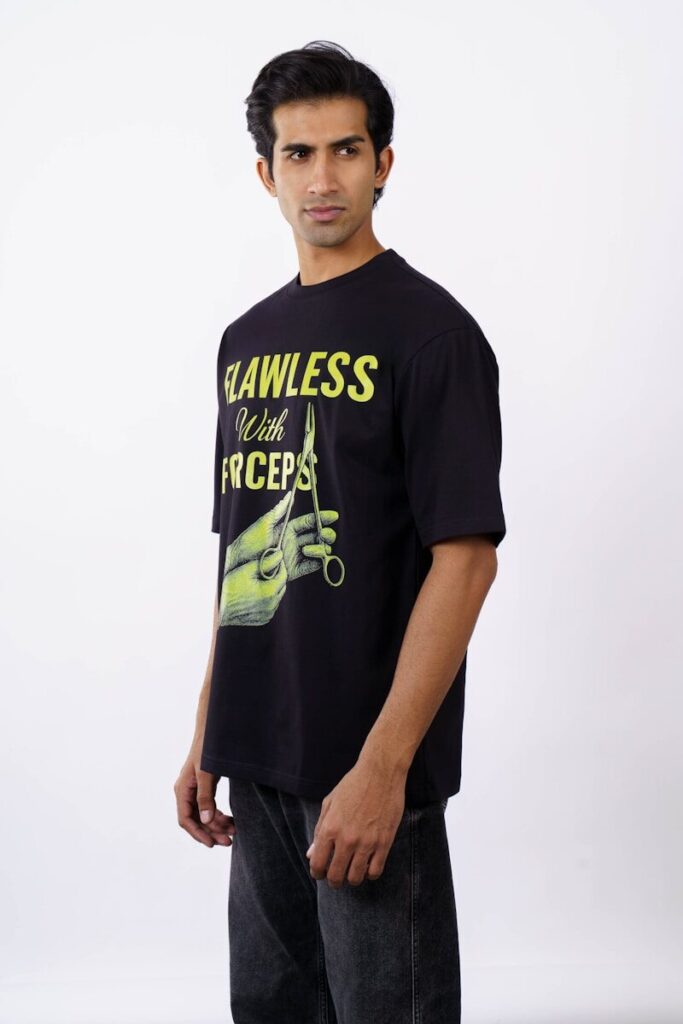 Man wearing a black t-shirt with graphic print