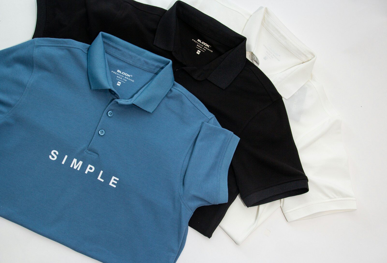 three polo shirts with the word simple printed on them 20 Benefits of DTF Transfers That Make Them a Game-Changer for Your Business