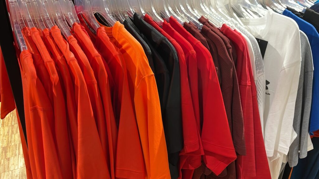 a rack of shirts hanging in a store