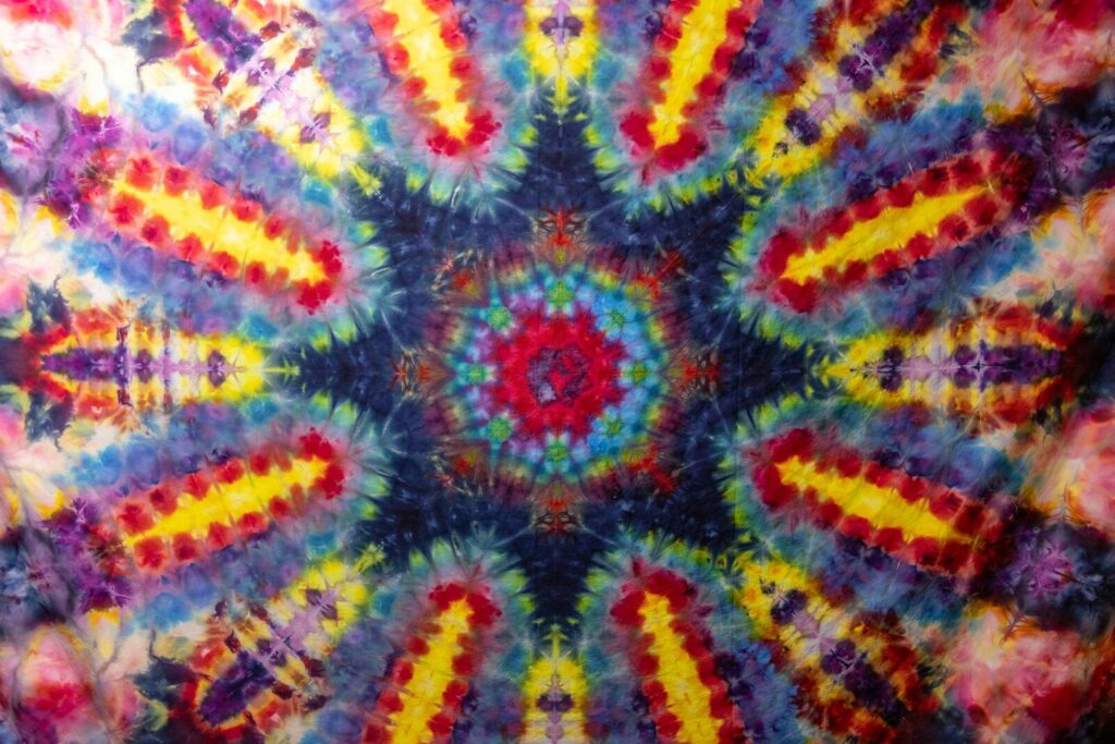 a tie - dyed picture of a colorful flower