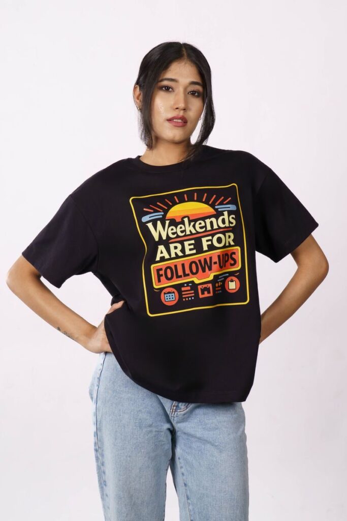 Stylish woman wearing an oversized t-shirt with 'Weekends are for Follow-ups' print, casual look.