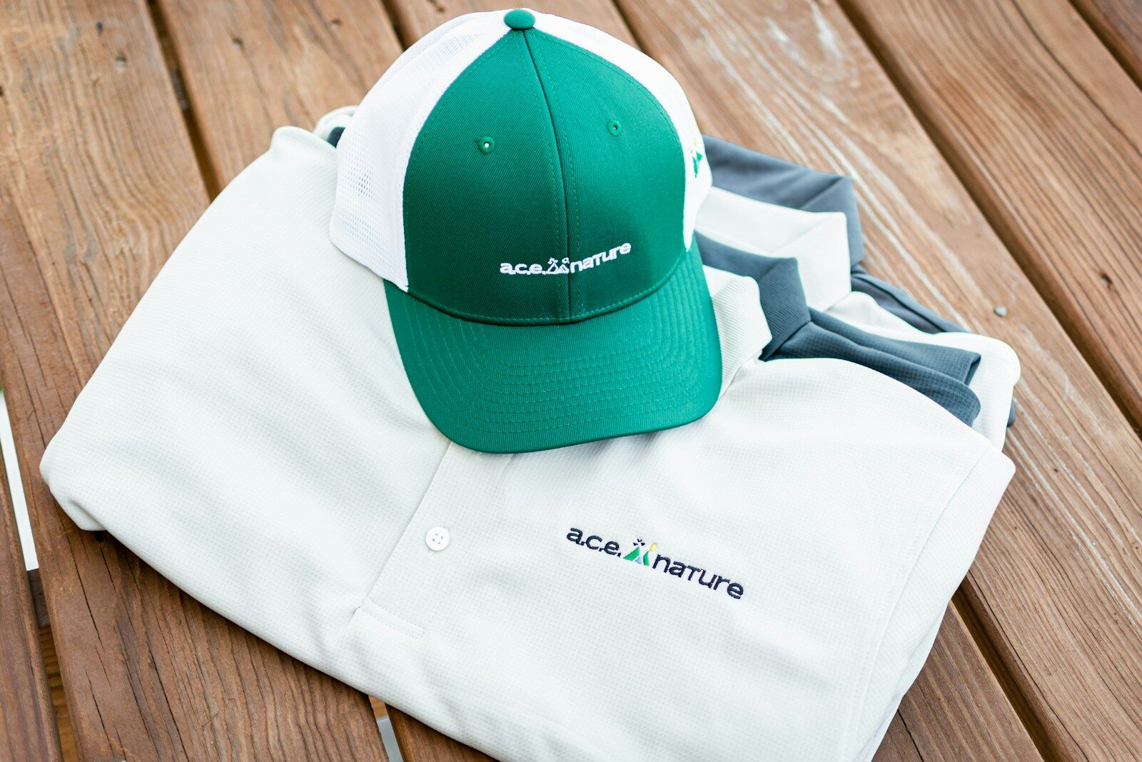 Photo by Will Breen a green and ready to press dtf transferswhite hat sitting on top of a white shirt